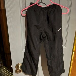 Nike Kids Black Joggers with White Swoosh